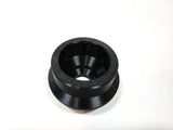 A black circular plastic stud with a textured inner surface and a flared base, photographed on a plain white background.