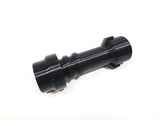 A black plastic cylindrical adapter or connector with a ribbed section and a small tab on one end, shown on a plain white background.